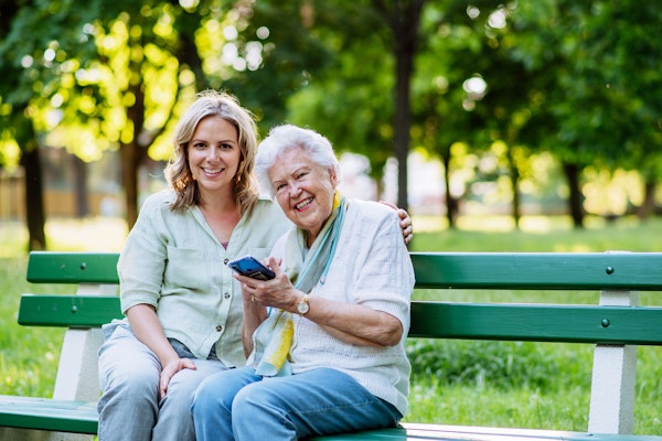 grandmother and granddaughter smiling