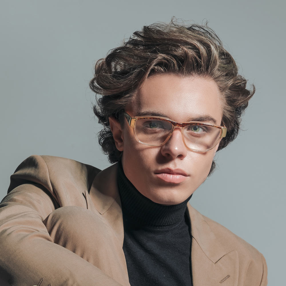 Fashionable man wearing new glasses