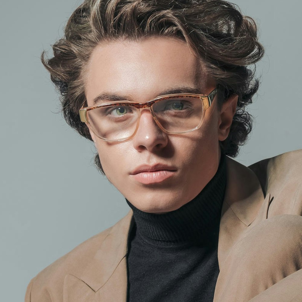 Fashionable man wearing new glasses