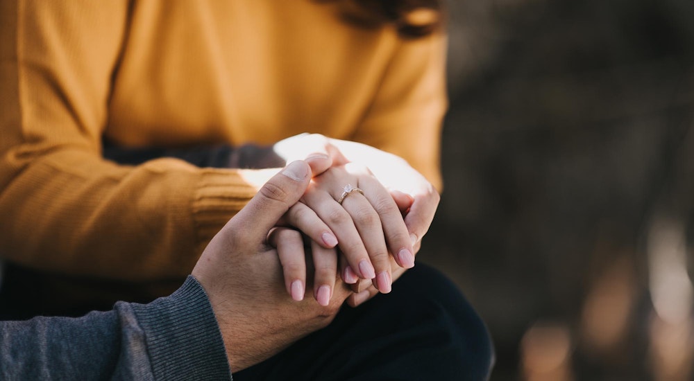 Couple holding hands