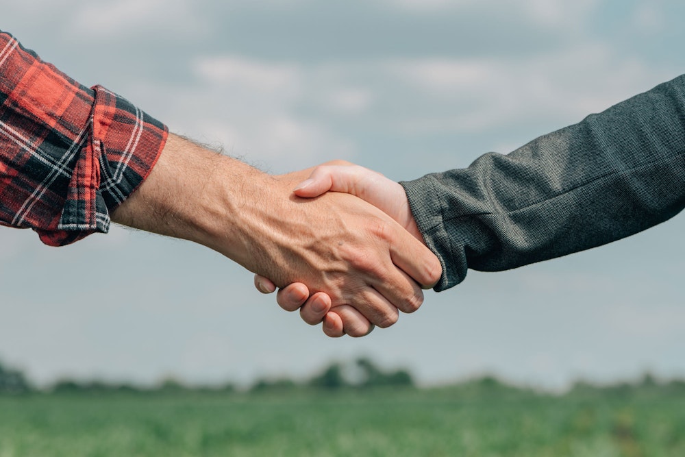 Farmer and Mr. Fisher shaking hands