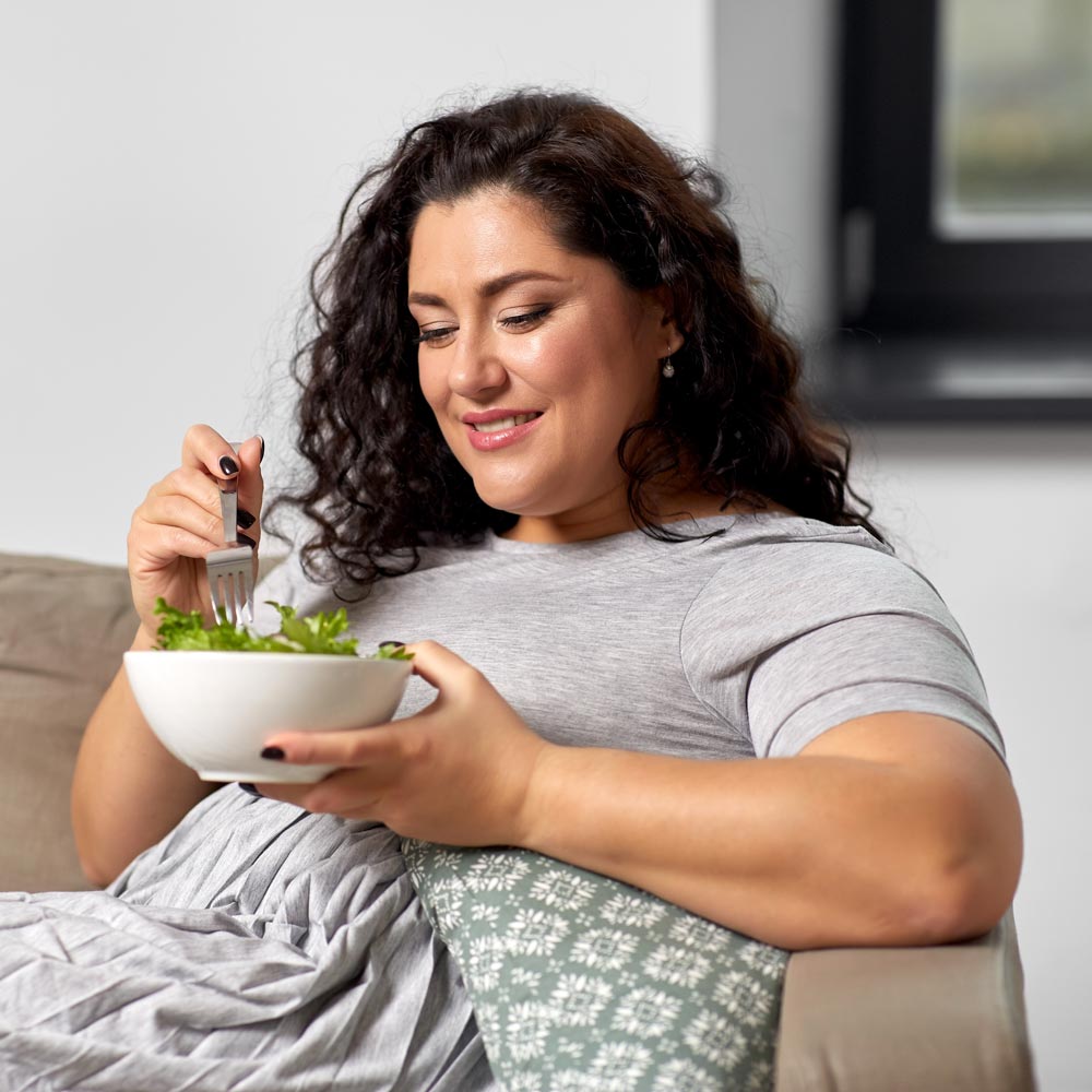 Woman eating salad