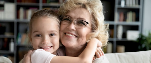 Grandmother hugging granddaughter