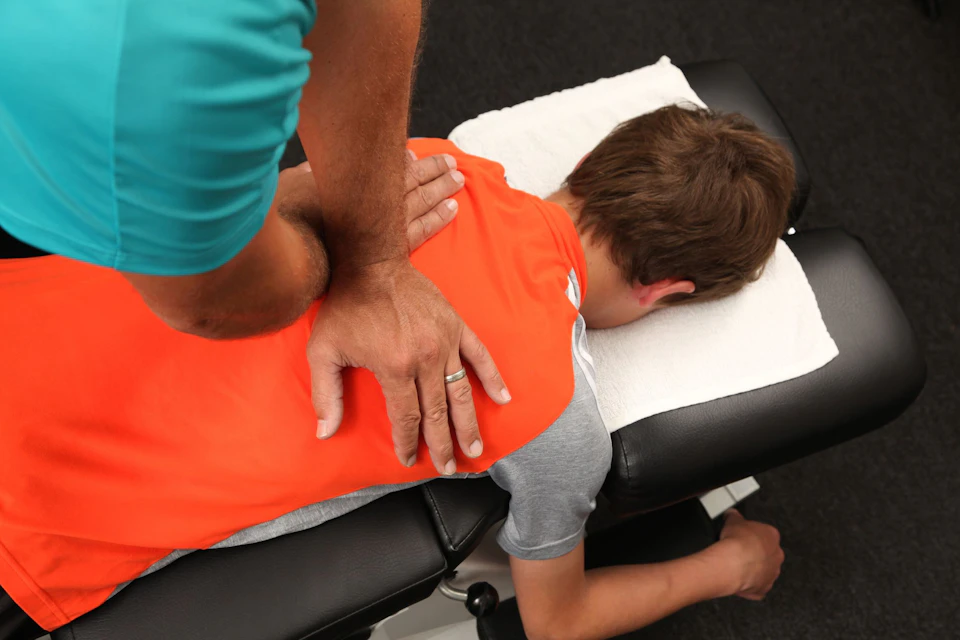 Photo of patient undergoing chiropractor care