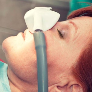 Woman receiving laughing gas