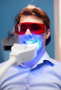 Man undergoing teeth whitening treatment