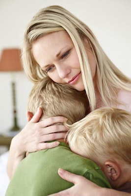 Mom and 2 kids hugging
