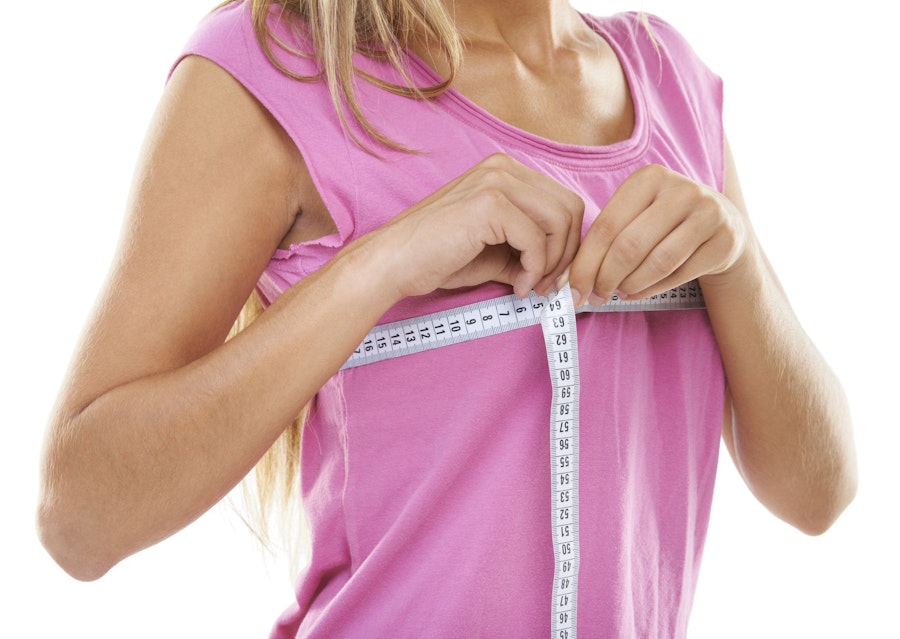 woman measuring her bust