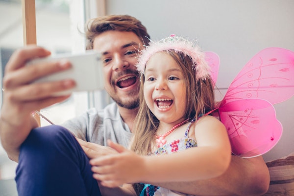 Father and daughter taking a selfie