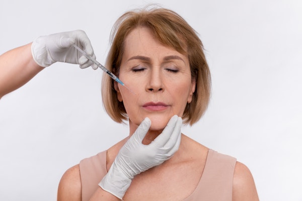 Woman receiving BOTOX in the face