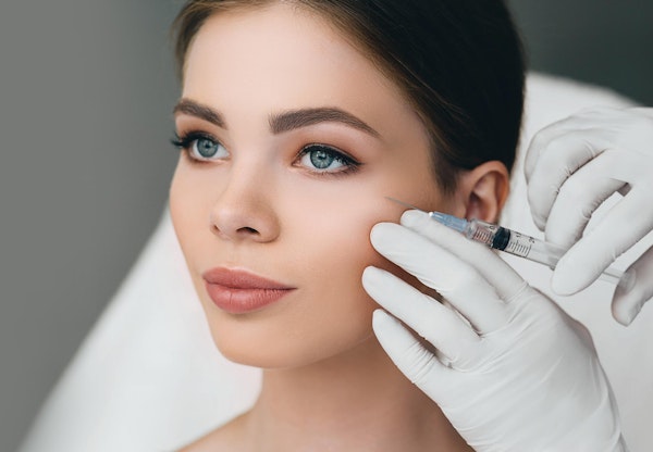 Woman receiving RHA injection