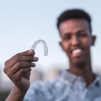 Man holding invisalign
