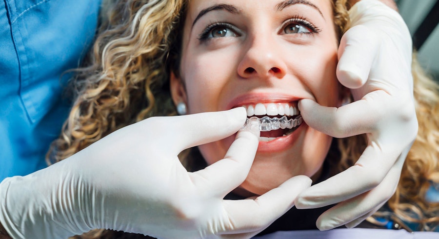 woman getting clear correct invisalign
