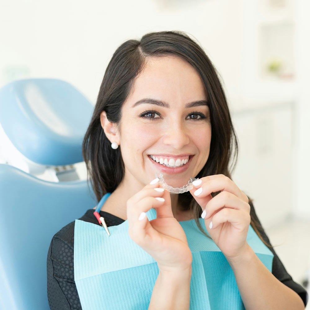 Smiling woman with ClearCorrect