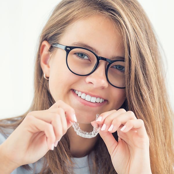 Young girl wearing invisalign