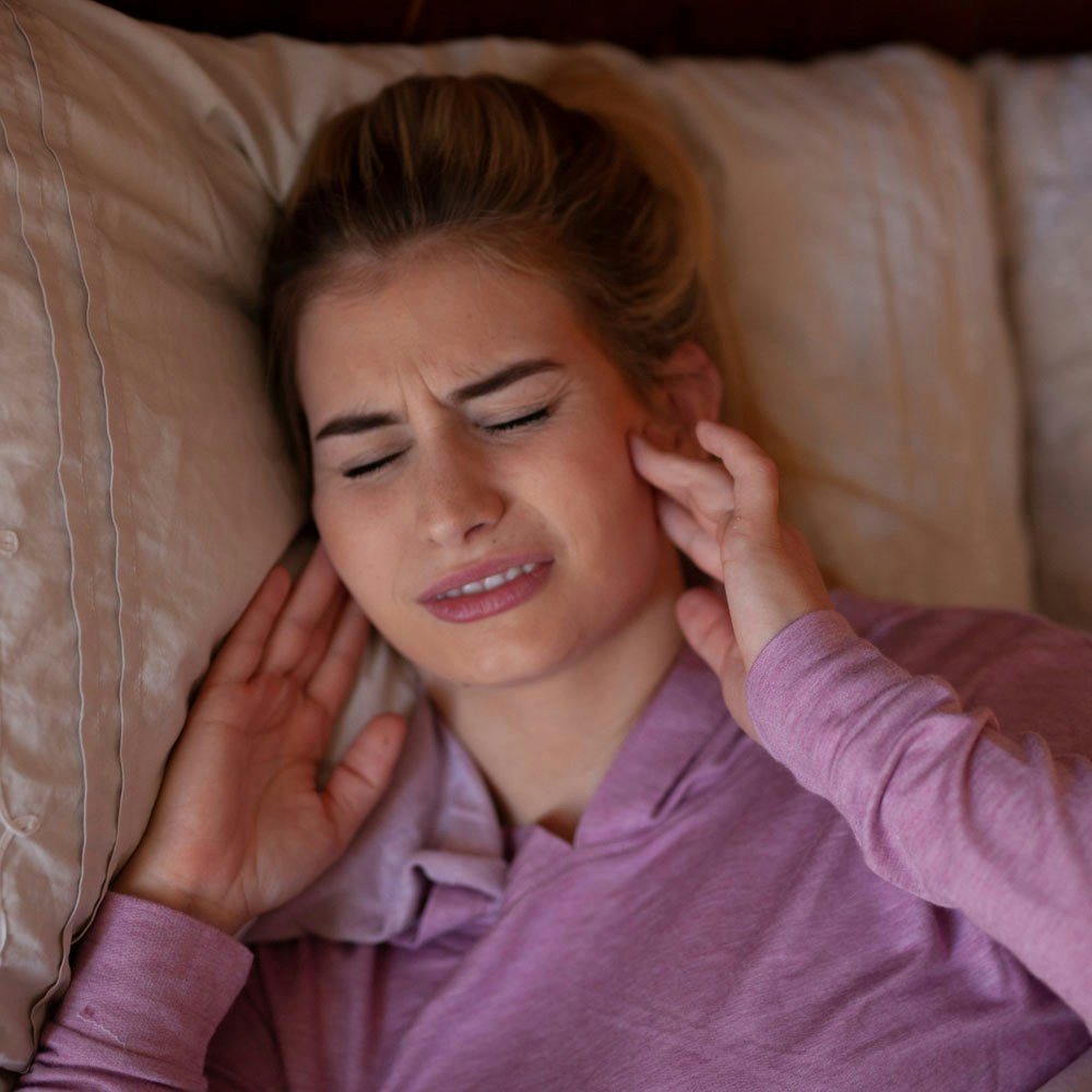 Woman with ringing in ears