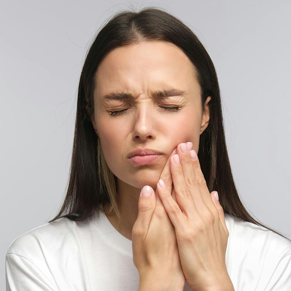 Woman with hurting wisdom tooth