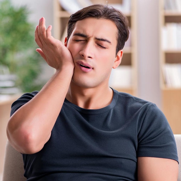 man with jaw pain