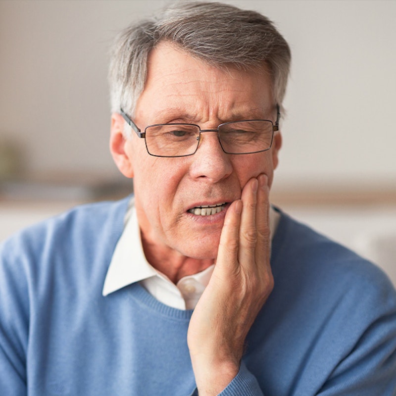 Guy with tooth pain