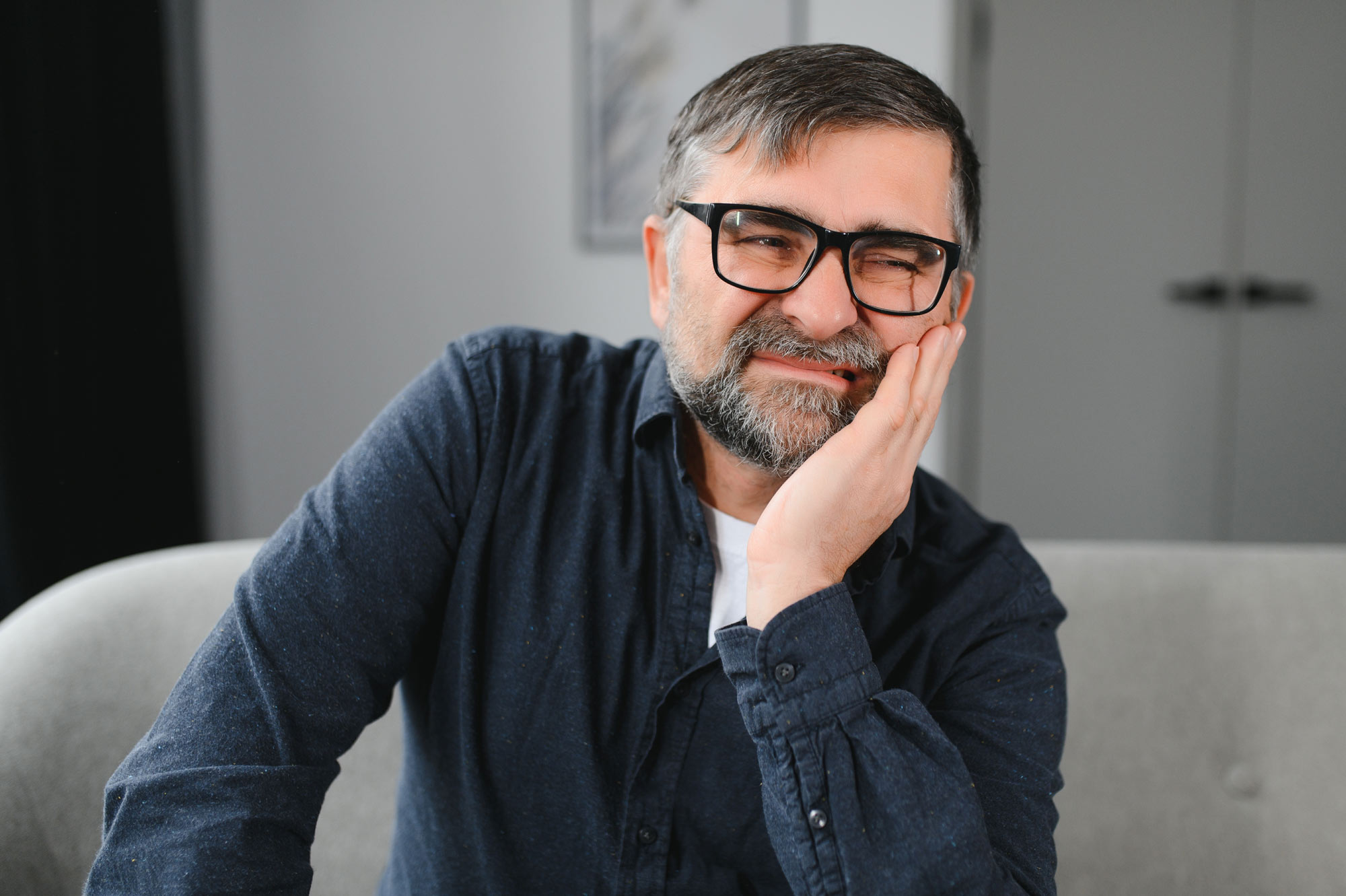 Worried man with bad breath and a toothache