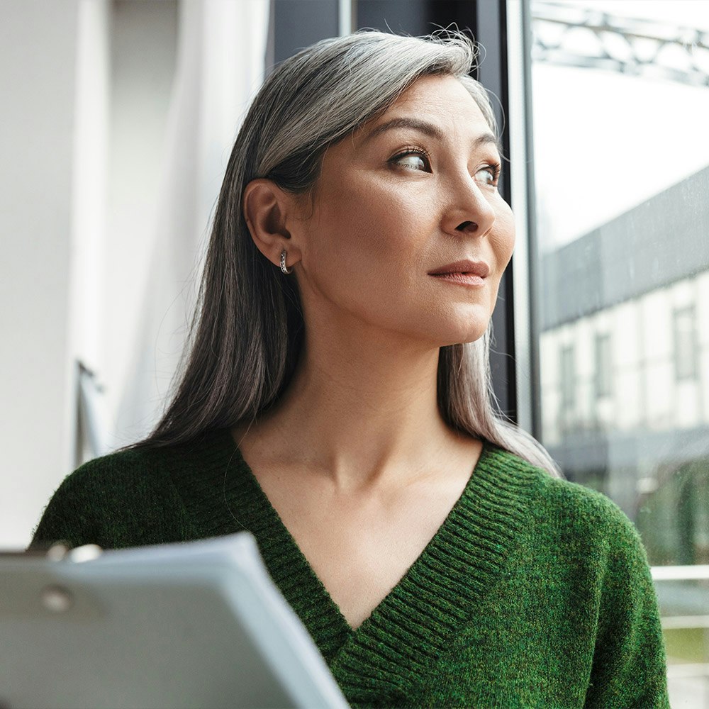 Lady looking out of window