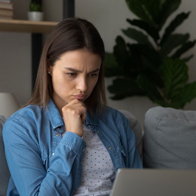 Woman looking at laptop