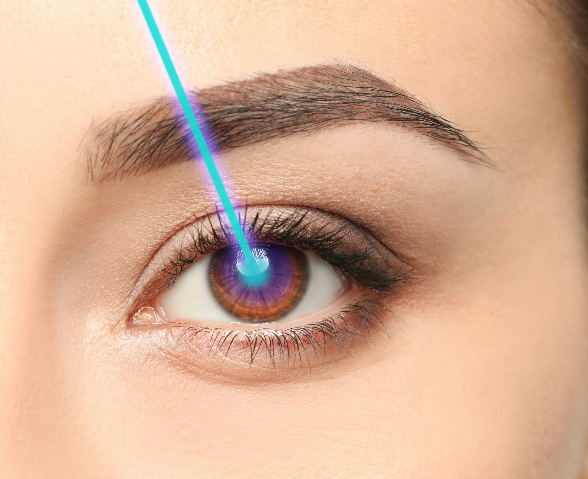 woman's eye and laser