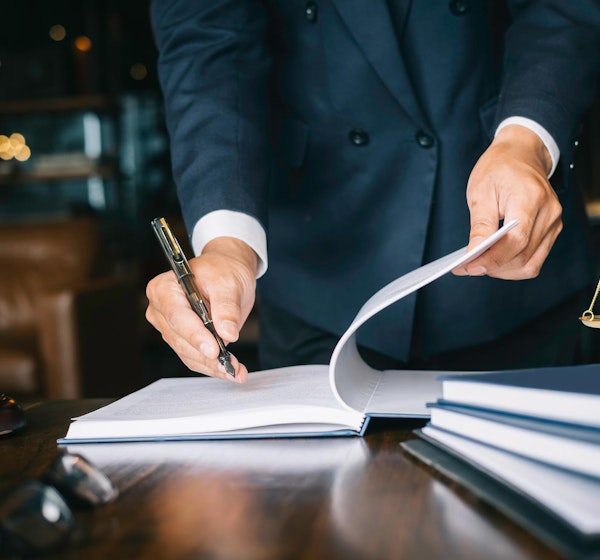 Lawyer writing on a piece of paper