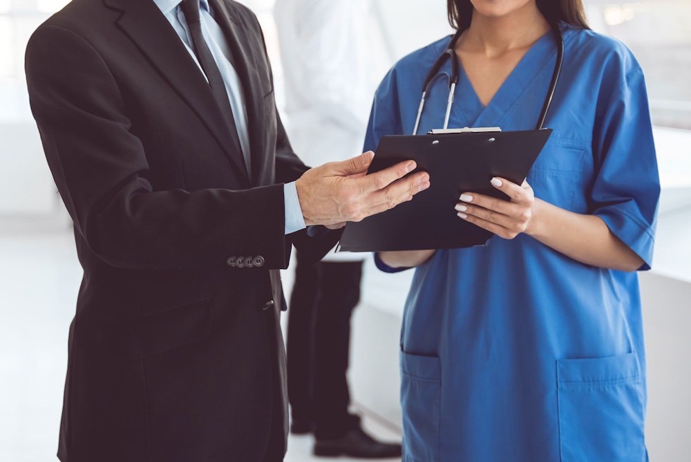 Medical professional talking to lawyer