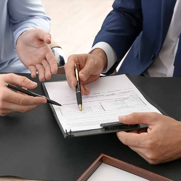 Lawyer going over different forms with client