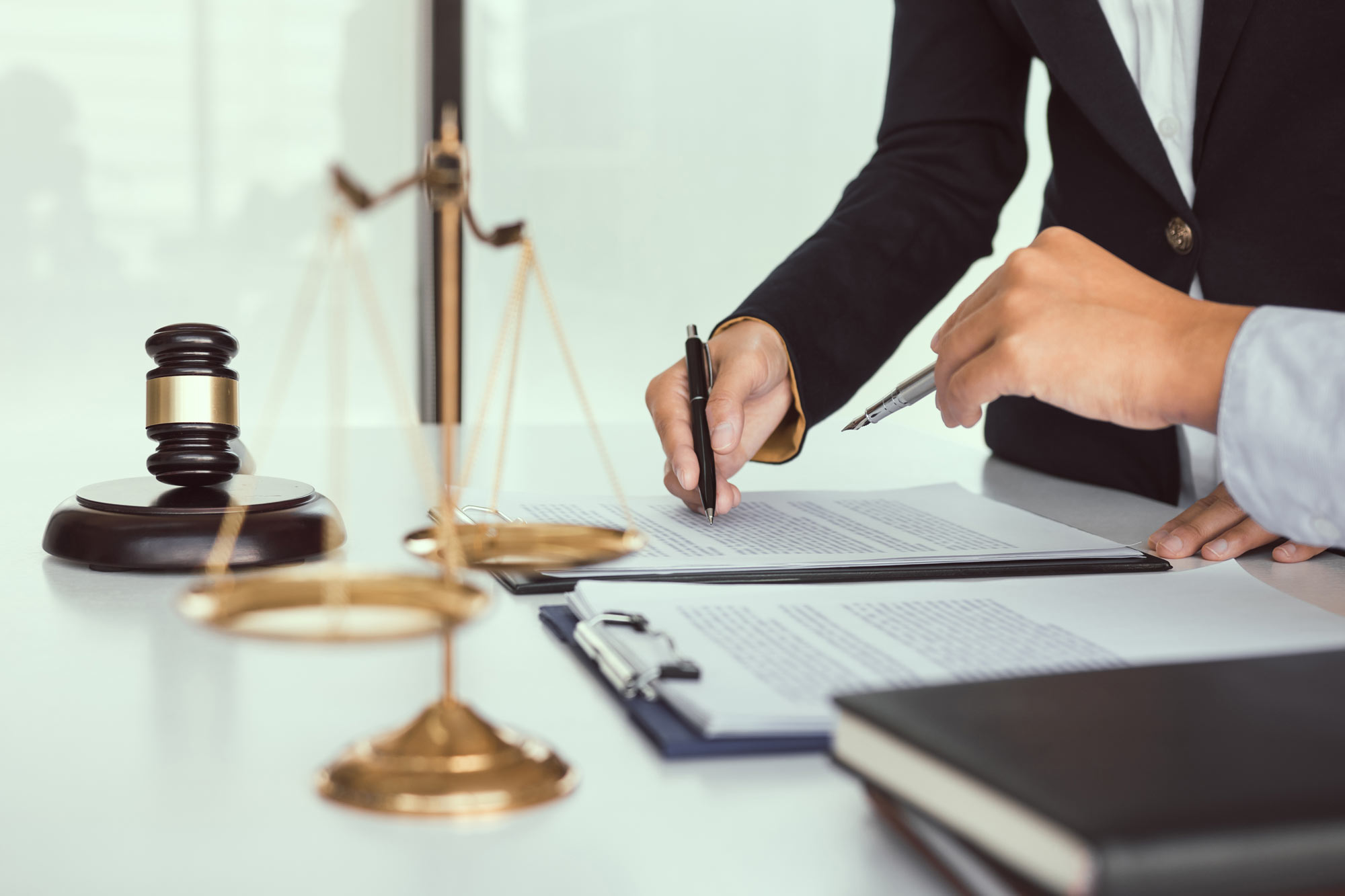 Lawyer going over Writ of Habeas Corpus with colleague