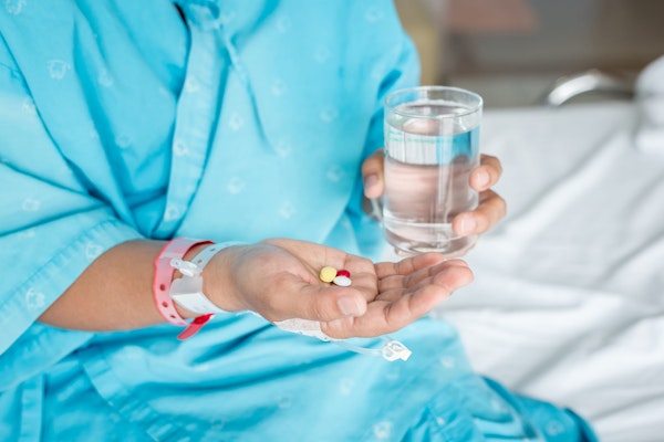 Hospital patient taking medication