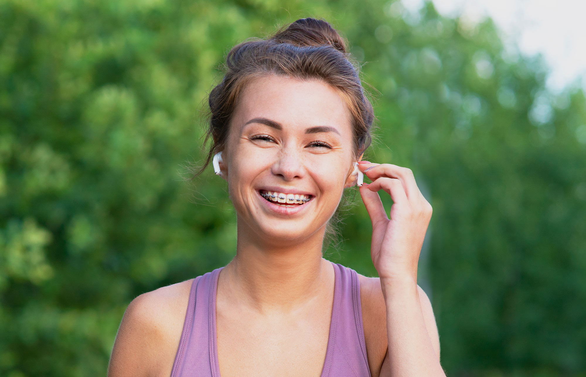 Young woman with braces outdoors on a run