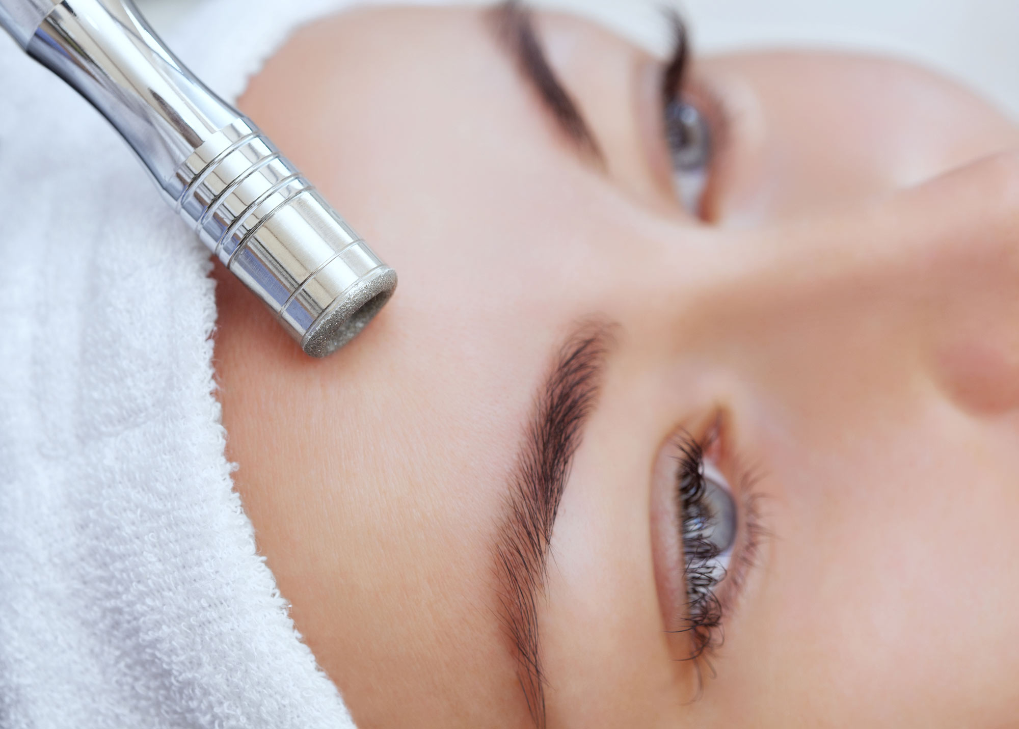 Woman receiving microdermabrasion