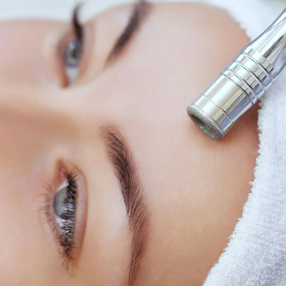 Woman receiving microdermabrasion