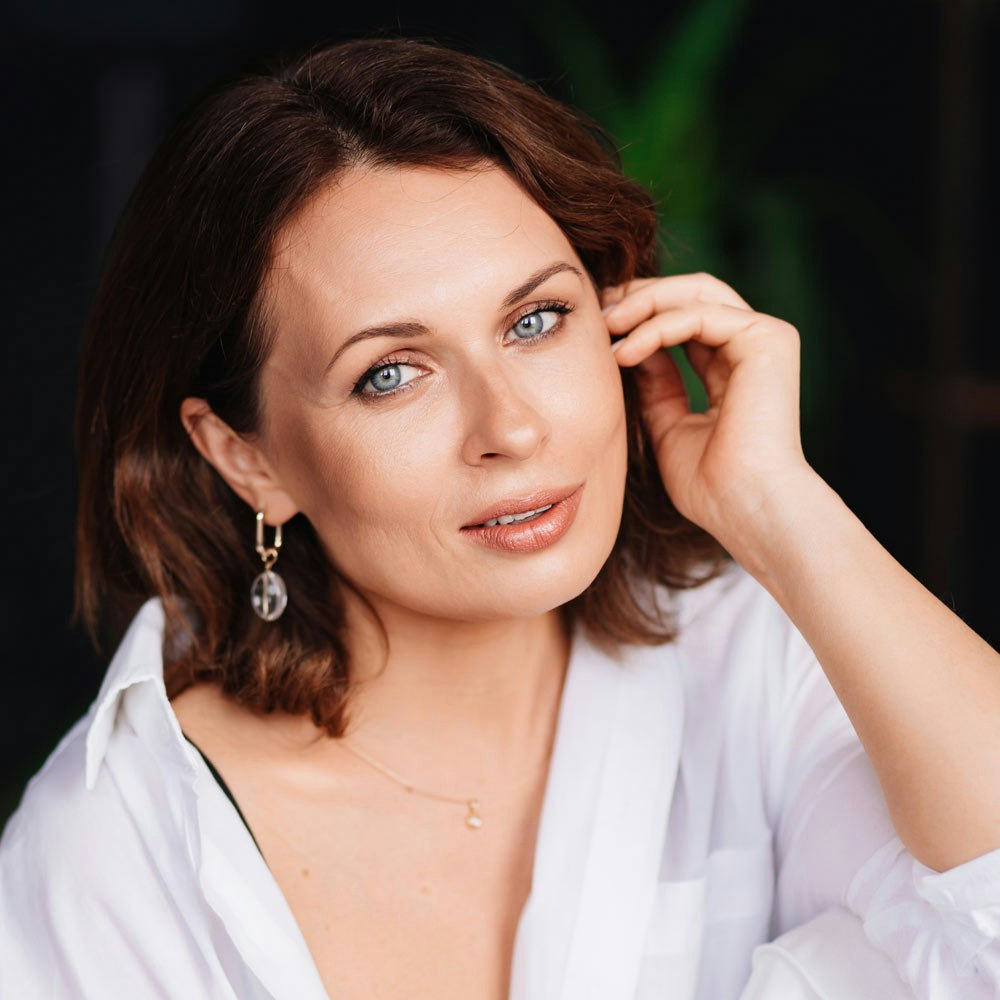 Woman with fingers framing eye