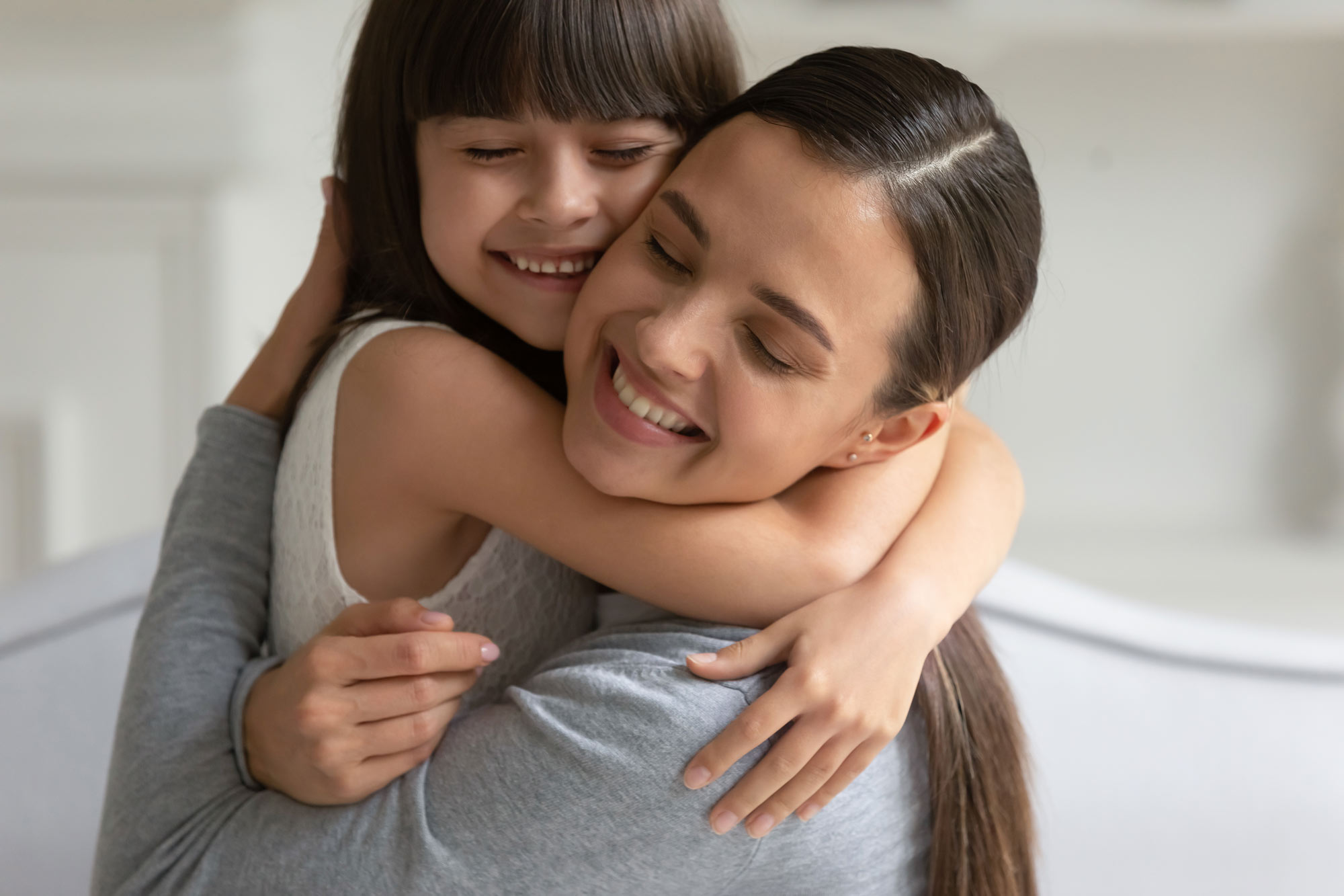Mother and daughter hugging
