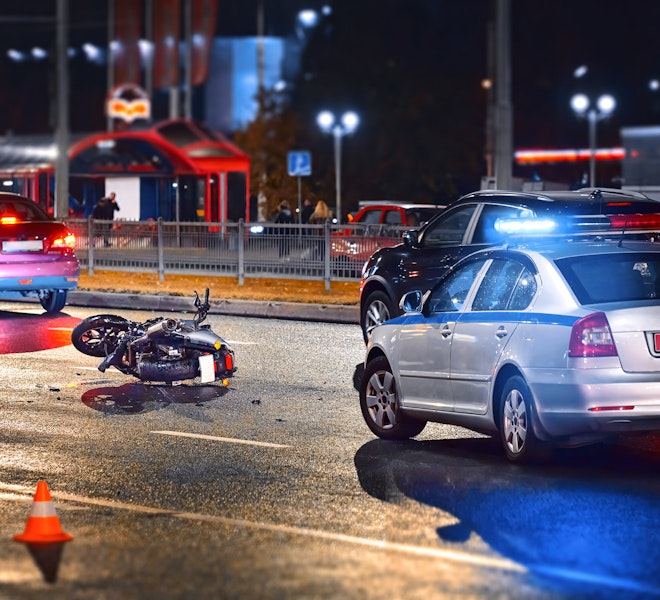 Accident Scene of motorcycle crash with car