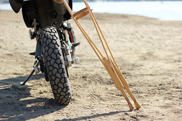 Close up of motorcycle and crutches