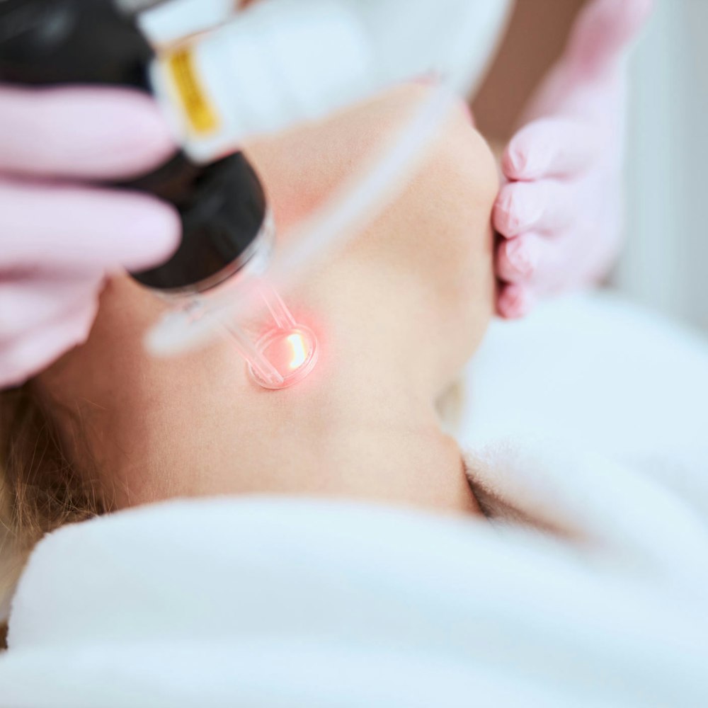 Woman undergoing laser neck lift