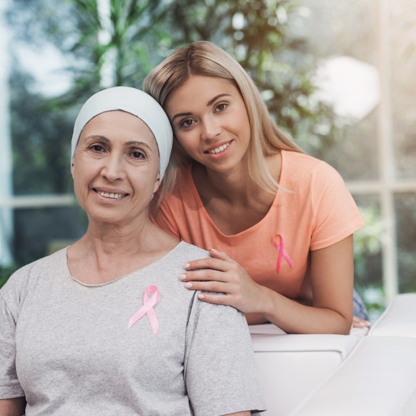 Mother fighting breast cancer with daughter's support