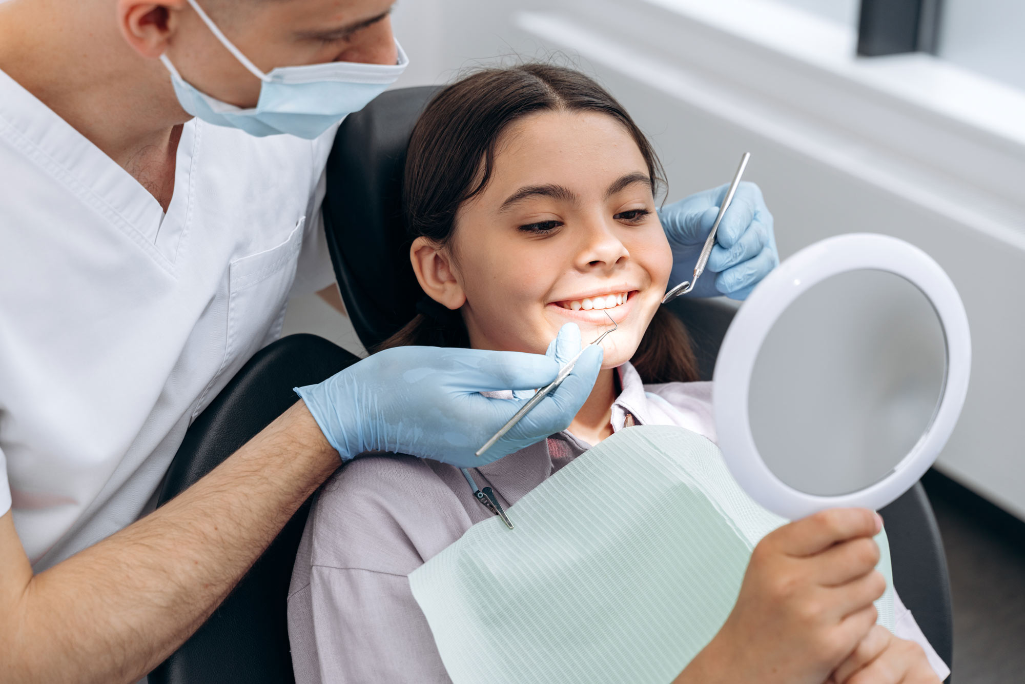 Smiling girl during a dental exam