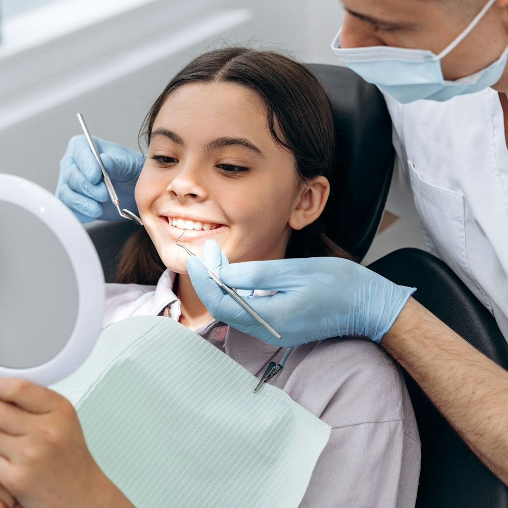 Smiling girl during a dental exam