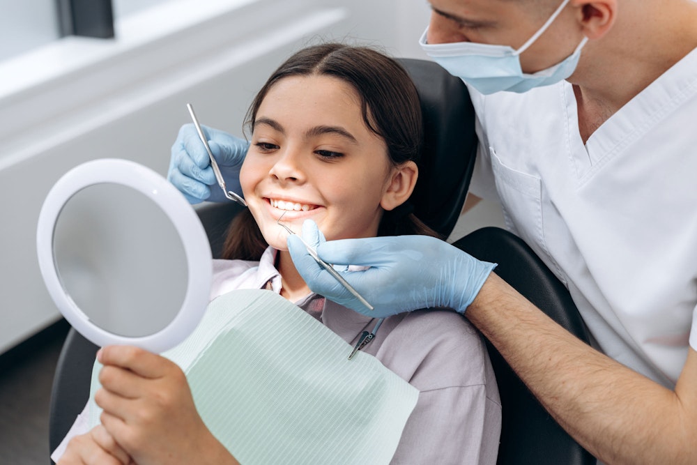 Smiling girl during a dental exam