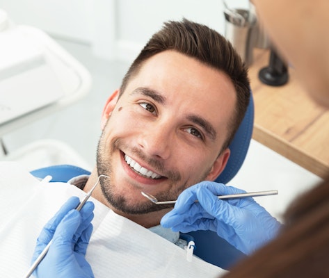 Smiling man in dental chair