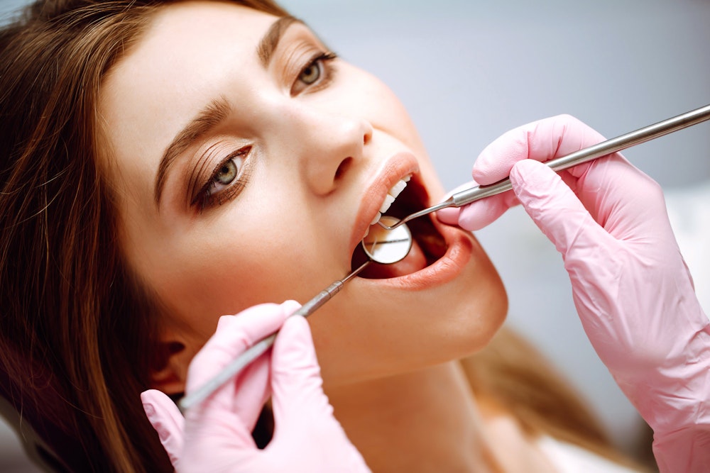 Dental patient getting teeth checked