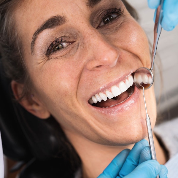 Woman smiling during oral exam