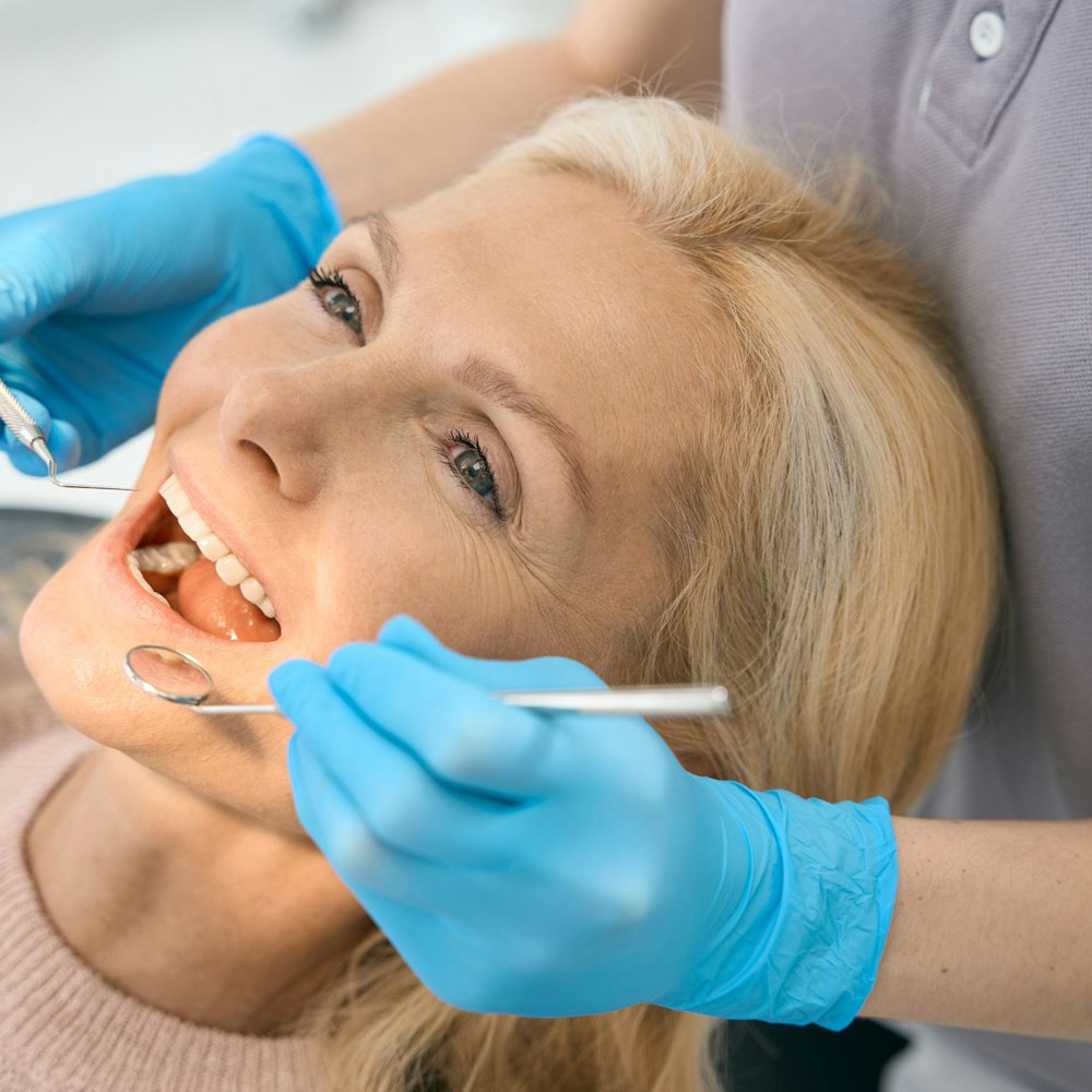 Dentist examining patient's teeth