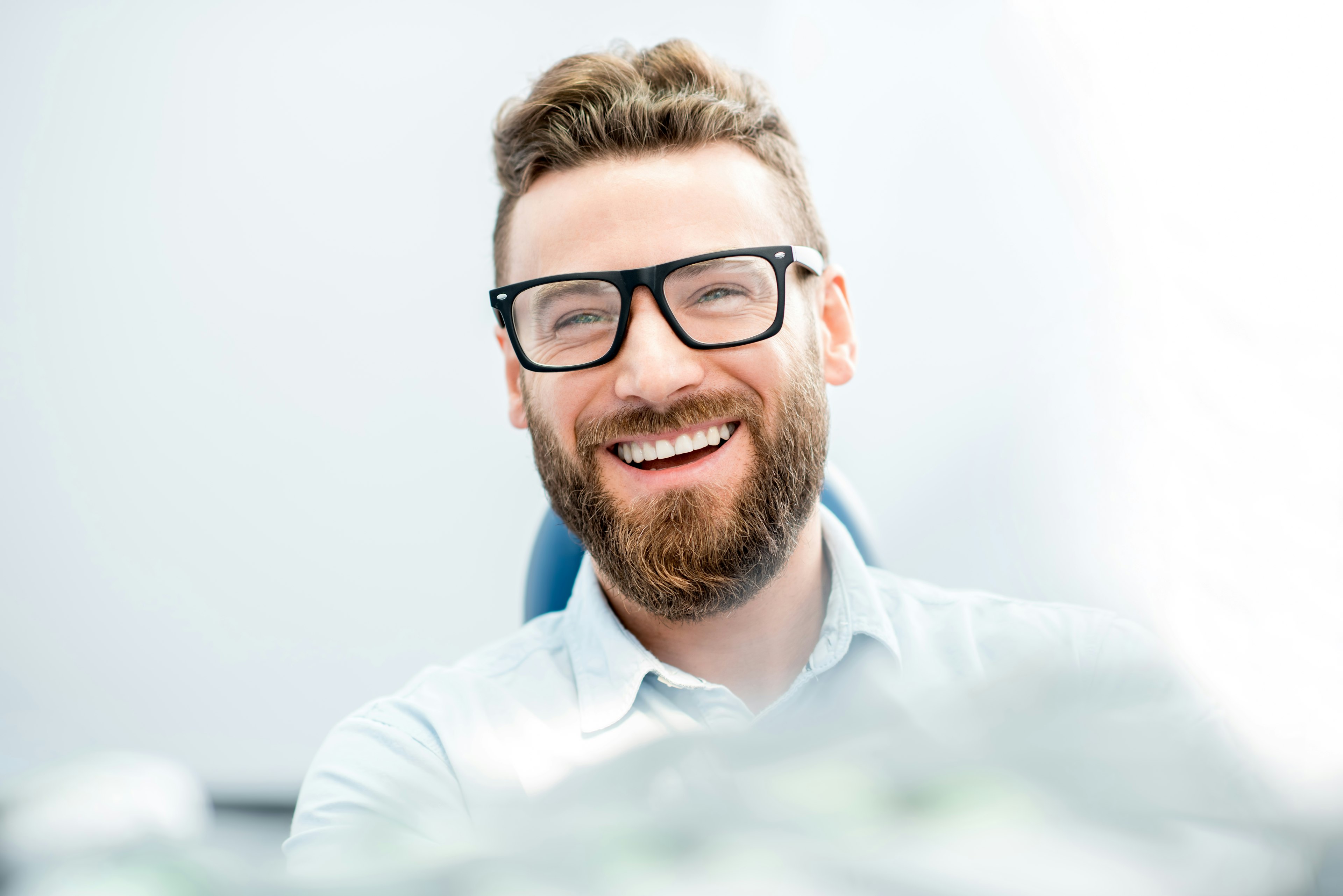 bearded man with glasses smiling