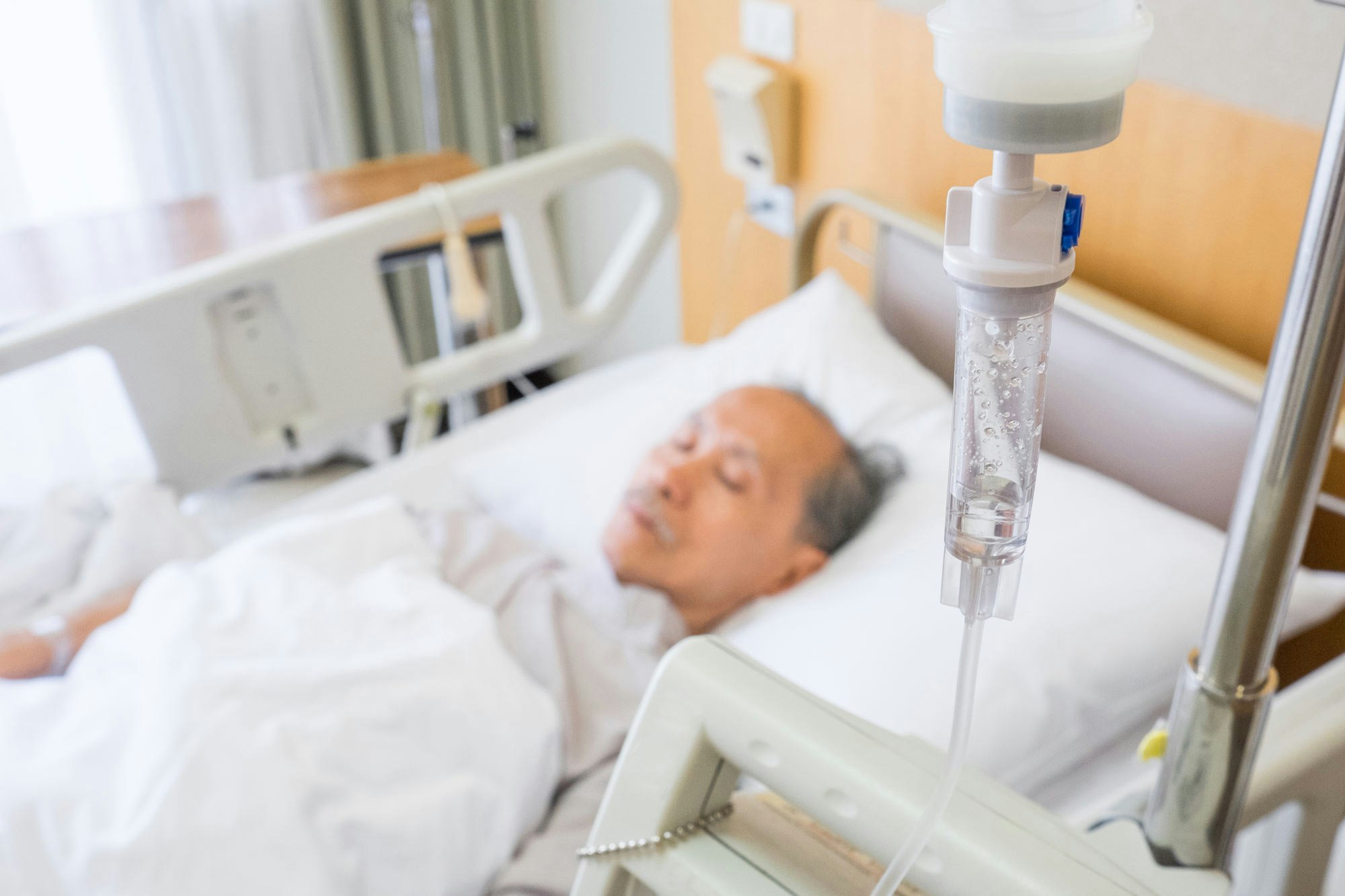 Patient in bed with IV